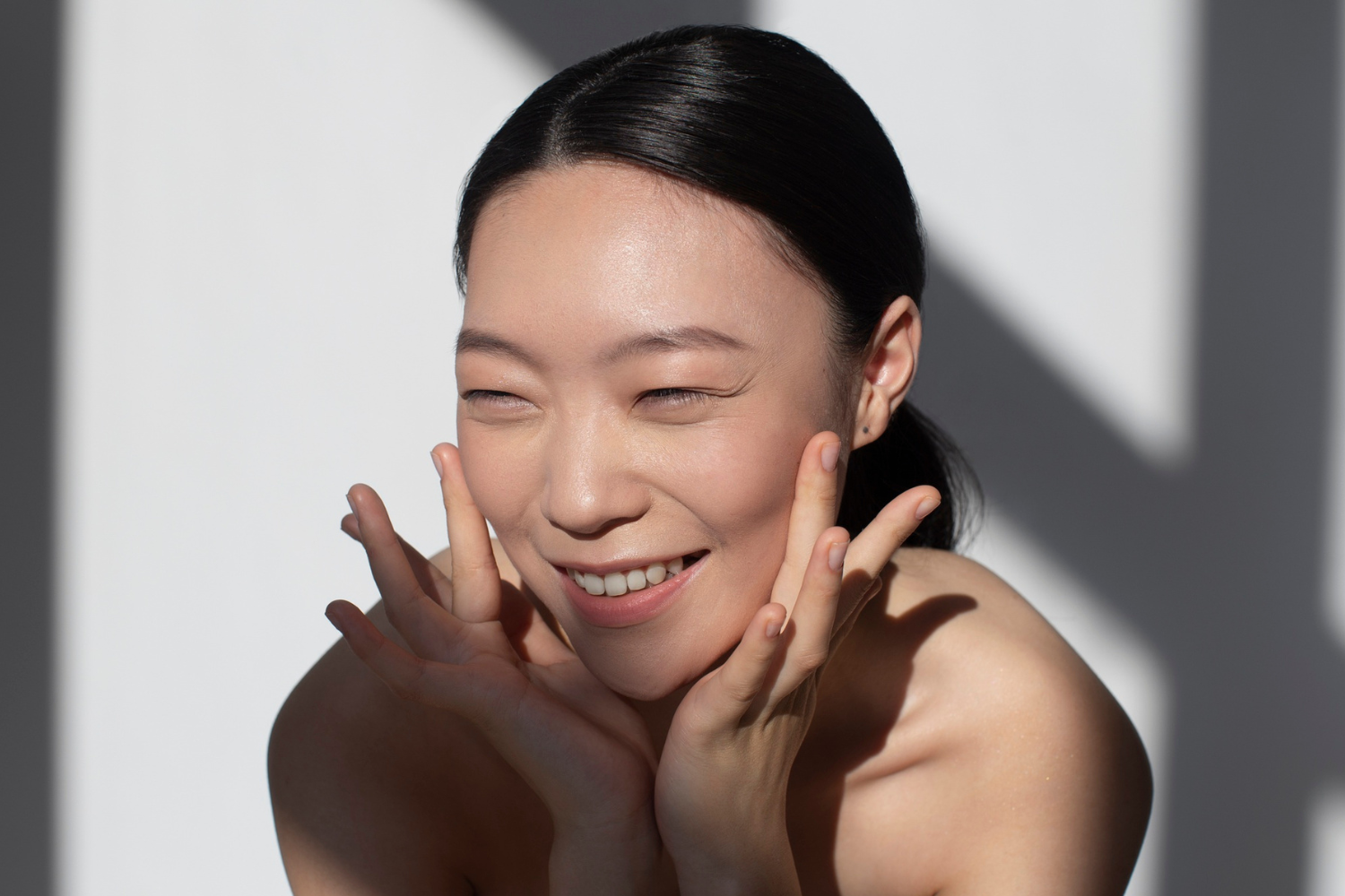 Japanese woman doing her skincare routine with Japanese skincare products.