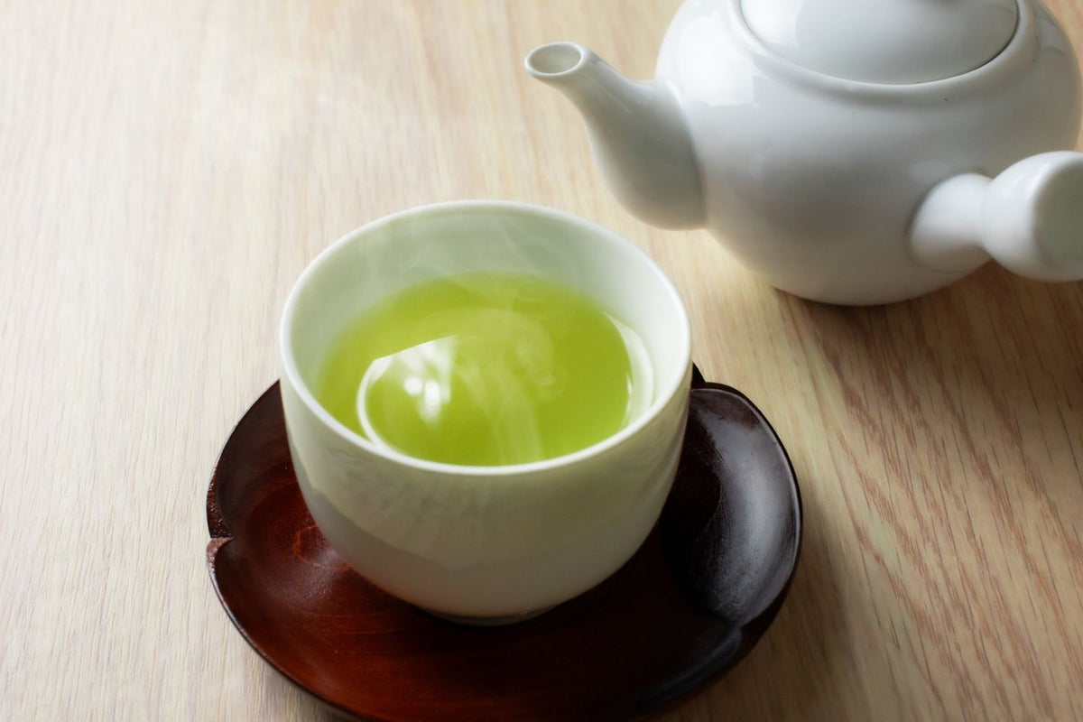 traditional Japanese teapot and green tea served in yunomi